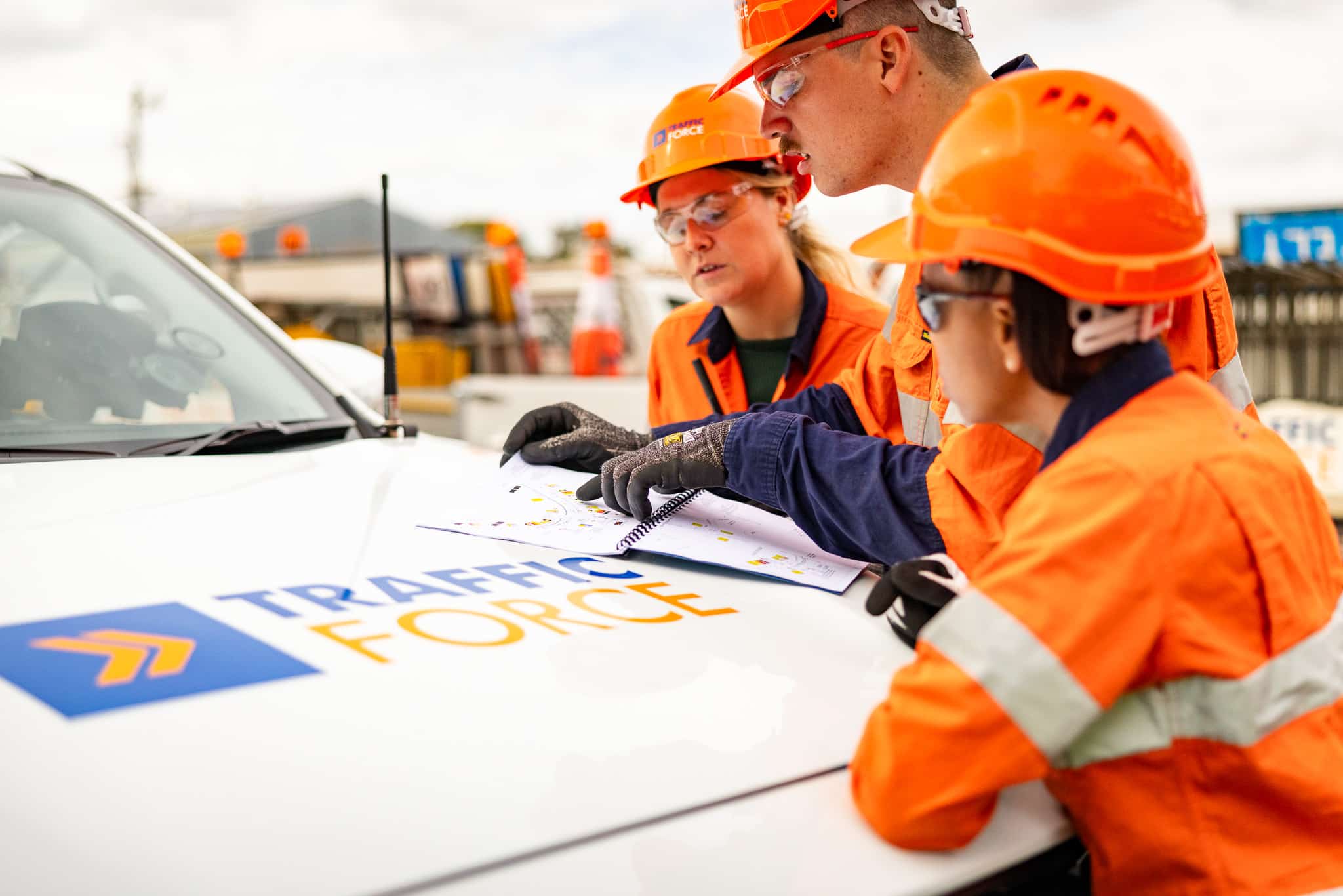 traffic controllers reading traffic management plans